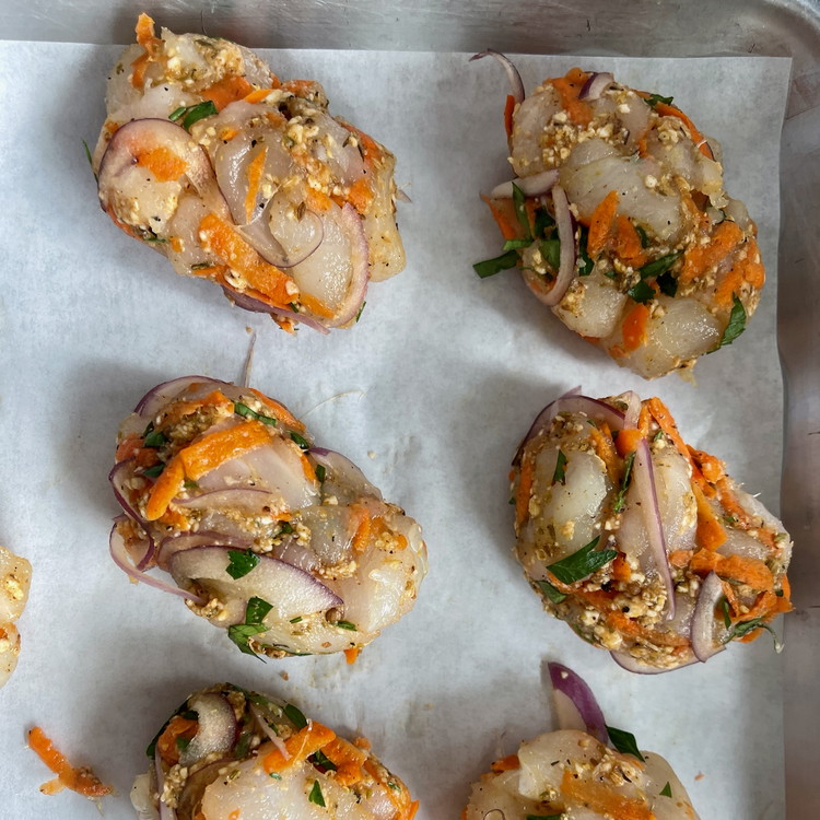 Image of Portion the mixture into ¼ cup oval patties and place them onto a parchment lined tray.