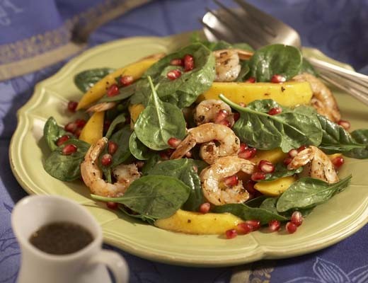 Image of Spinach Salad with Spicy Grilled Shrimp and Pomegranate Seeds