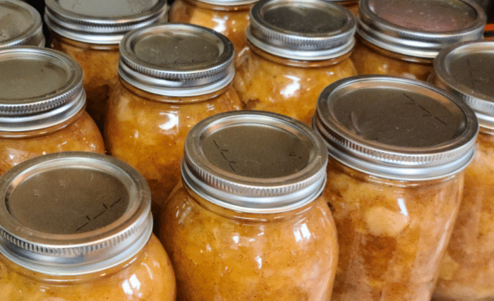 Image of  Fill your jars up with applesauce leaving ½ inch of...