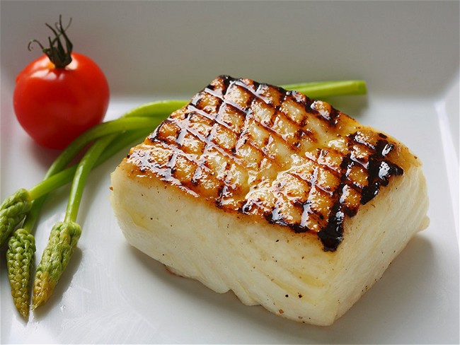 Image of Grilled Chilean Sea Bass with Asparagus Sprigs Recipe
