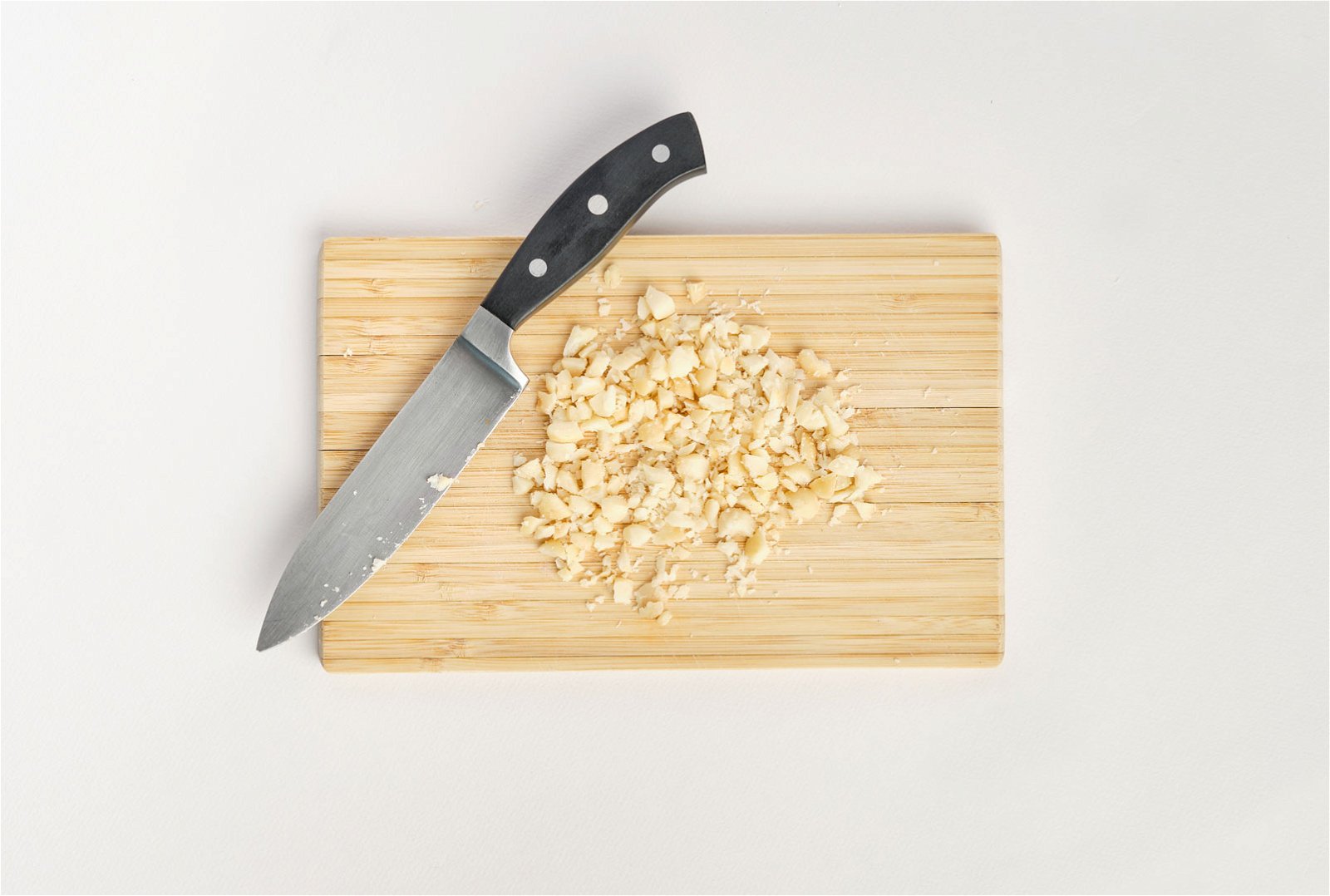 Image of Chop the unsalted macadamias. You maybe tempted to pulse or...