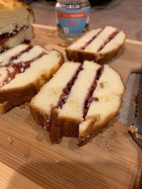 Image of Spread Unicoi Preserves over the bottom layer of cake, stack...