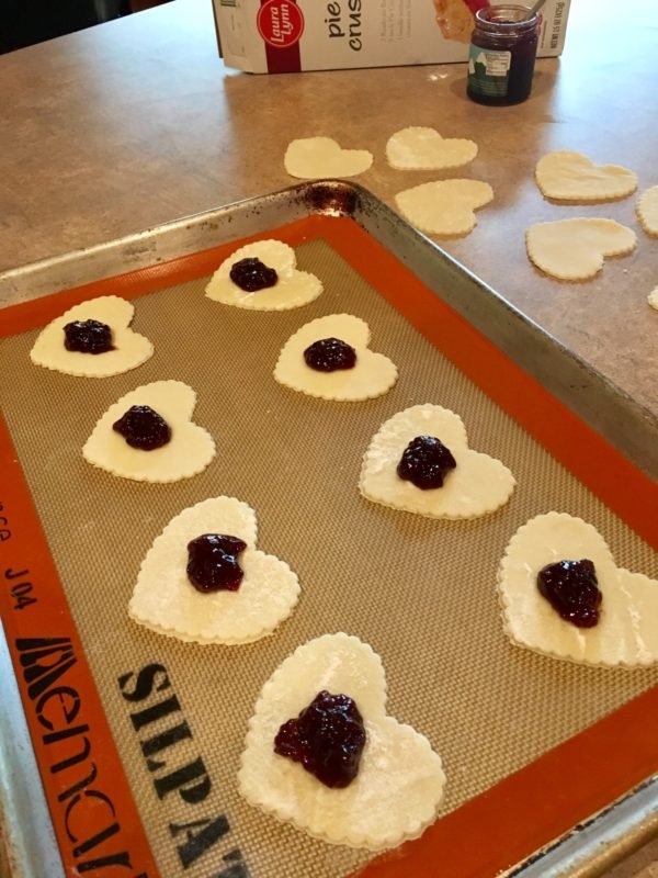 Image of To make your Heart Tarts, place half the hearts on...