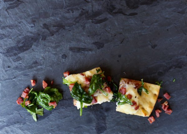 Image of Top the pizza with the baby arugula mixture. Transfer to...