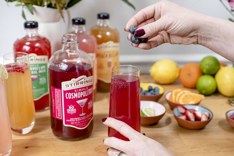 Image of Optional: Rub the rim of a flute with a lemon wedge, then rim in Cosmopolitan Martini Rimming Sugar. Pour in 3 ounces Cosmopolitan Mixer and top with 4-5 ounces champagne. Garnish as desired.Find Full Recipe Here>