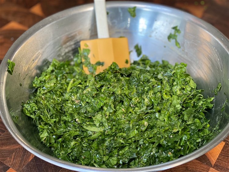Image of Finely chop the spinach and herbs. Then add to them...