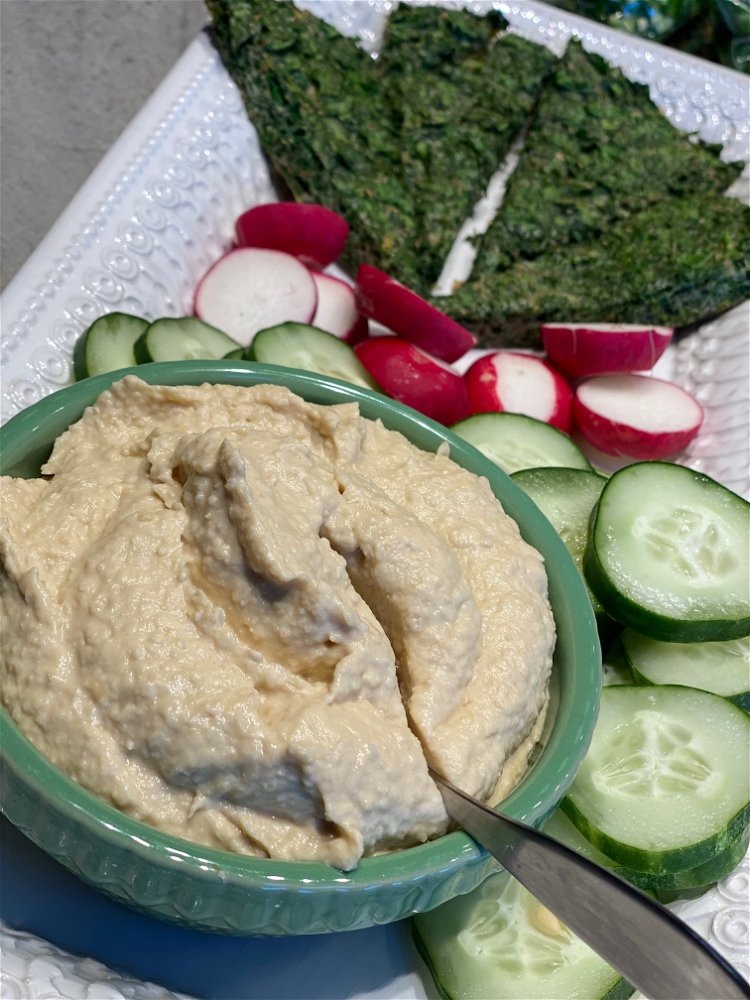 Image of Serve with pita bread, hummus, tomatoes, cucumbers, radishes & olives...