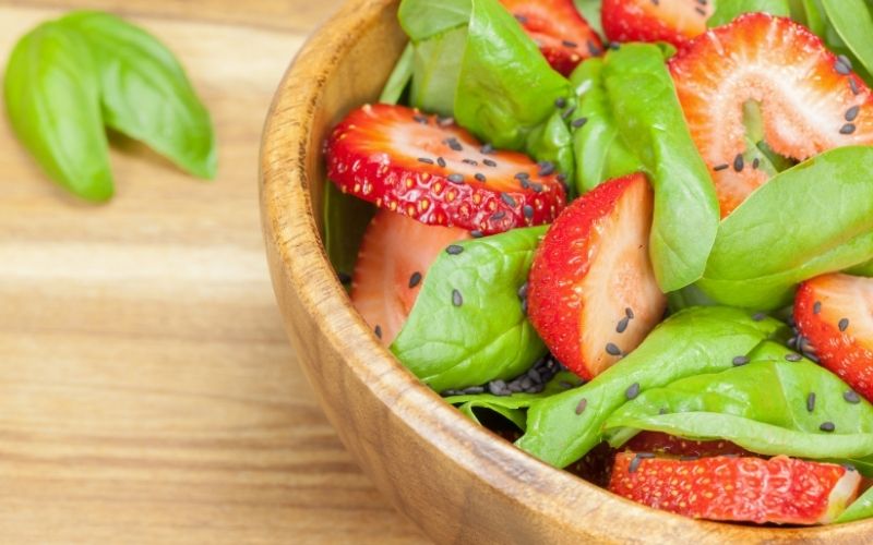 Spinach Salad with Strawberry on a bowl