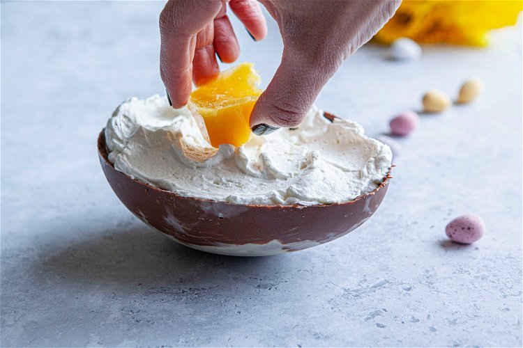 Image of Unmould your fruit puree ice cube and place a cube...