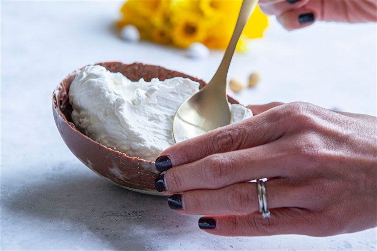 Image of Take the two-egg halves out of the fridge and spoon...