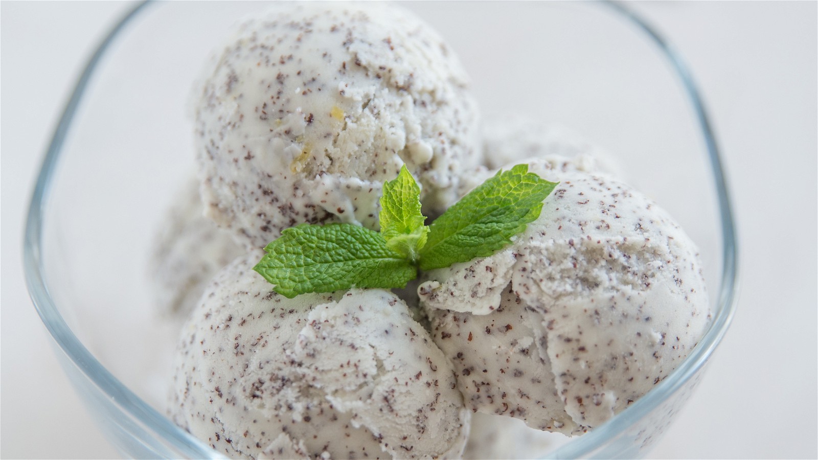 Image of LEMON POPPY SEED ICE CREAM WITH STRAWBERRY SAUCE