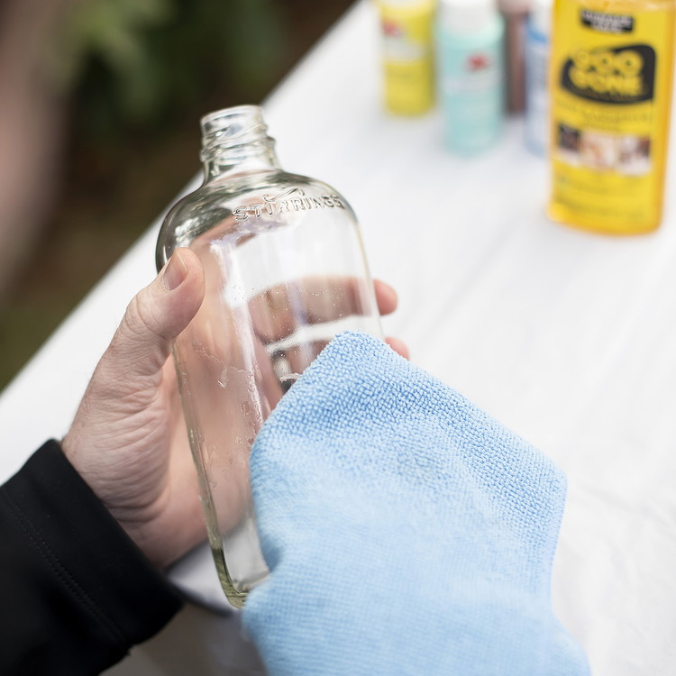 Image of Put Goo Be Gone on a clean rag and wipe off the remaining sticky glue.