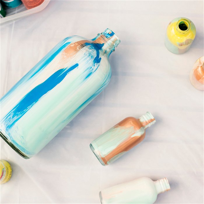 A water bottle decorated with glass paint