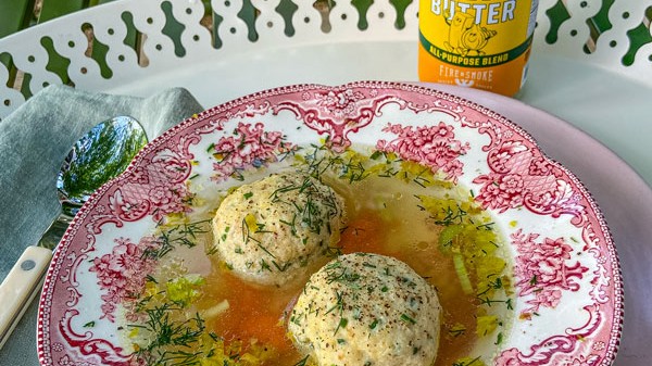 https://images.getrecipekit.com/20220412200218-matzo-ball-soup-with-onion-butter-and-dill.jpg?aspect_ratio=16:9&quality=90&