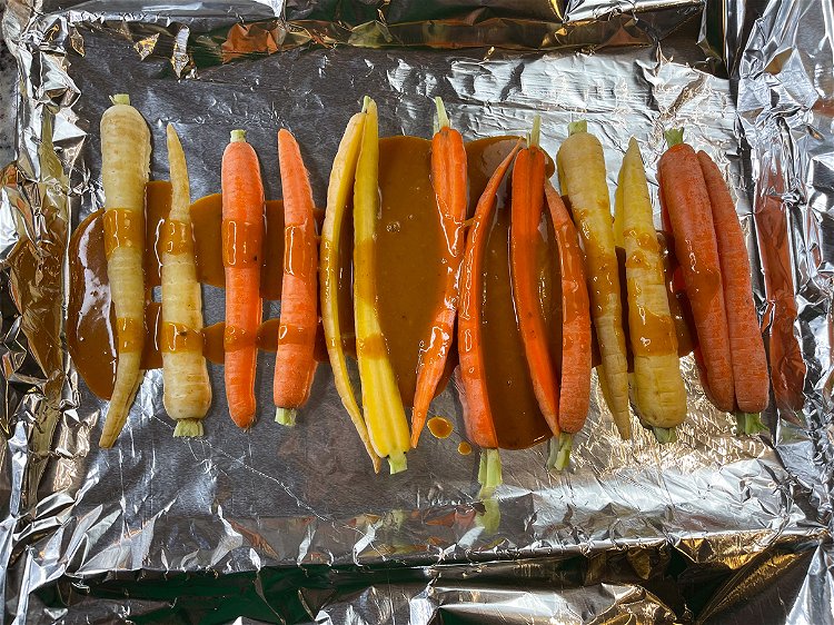 Image of Coat the carrots in the sauce.