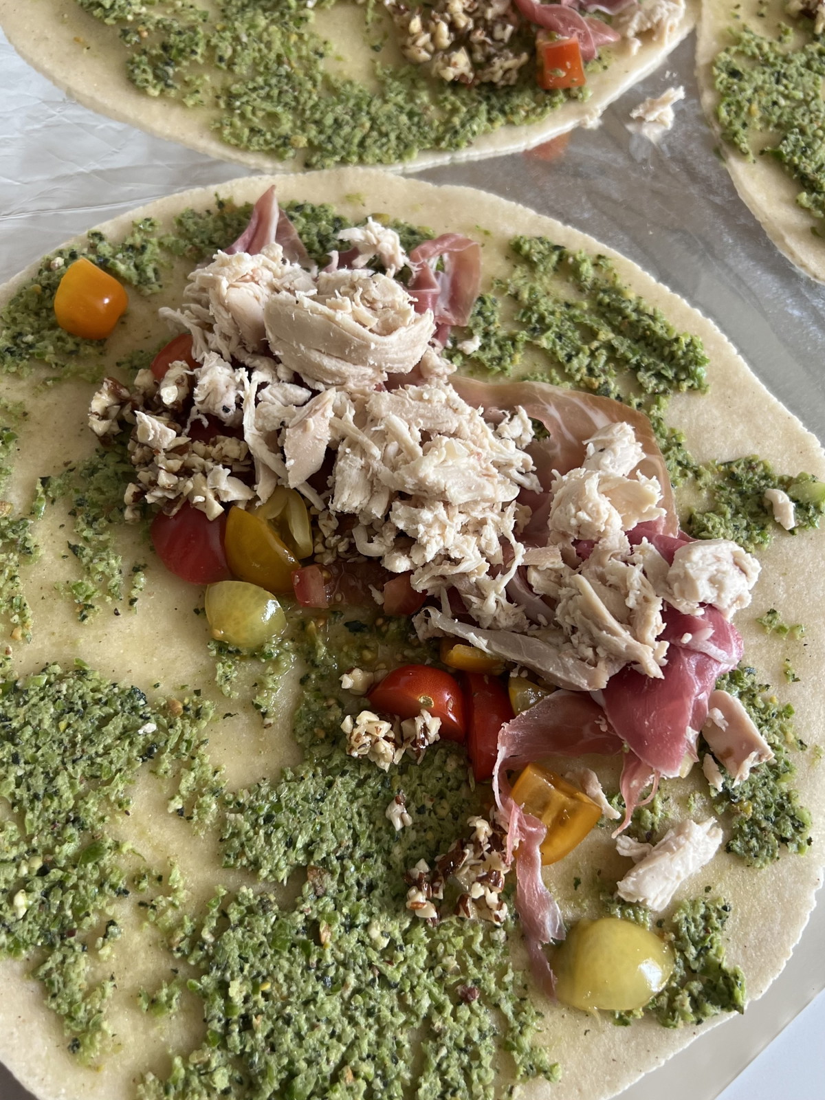 Siete Wraps w/ Prosciutto, Roasted Chicken, DF Pesto, Hot Honey Almonds, Balsamic Tomatoes + Greens