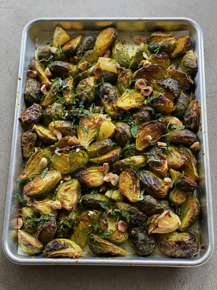 Image of Bake for 15 to 20 minutes. You want them to be slightly tender, charred but not too soft. Remove from the oven and drizzle with lemon juice, and a bit of olive oil.