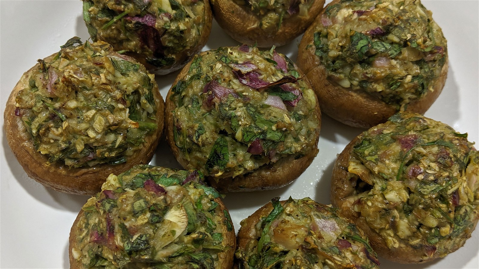 Image of SPINACH-WALNUT PESTO AND PIGNOLIA CHEESE-STUFFED MUSHROOMS