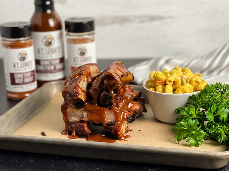 Image of Pull the ribs from the smoker and let rest for 10 minutes. Cut and serve with sauces! Enjoy!