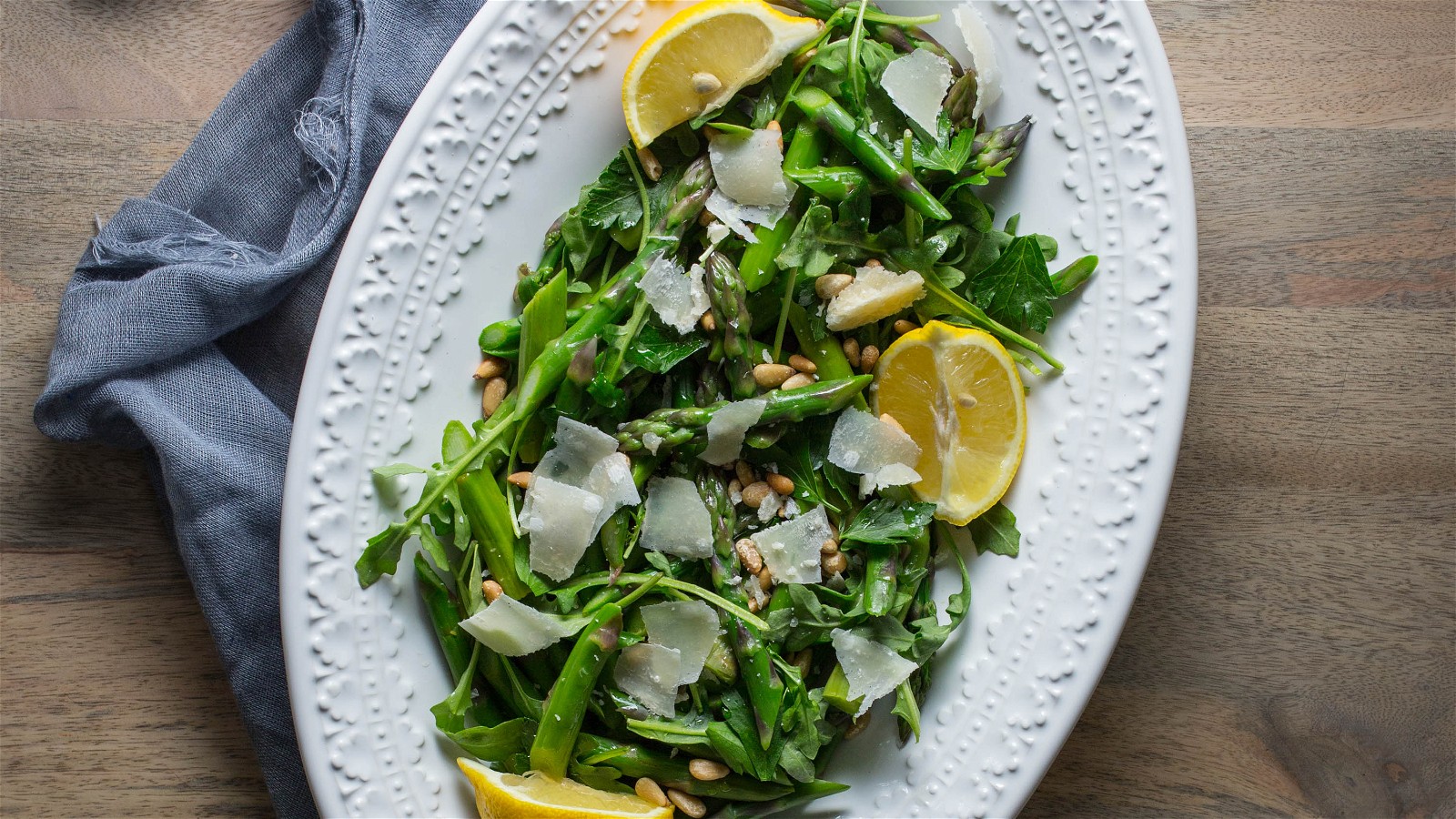 Image of Blanched Asparagus with Arugula, Pine Nuts, and Shaved Parm