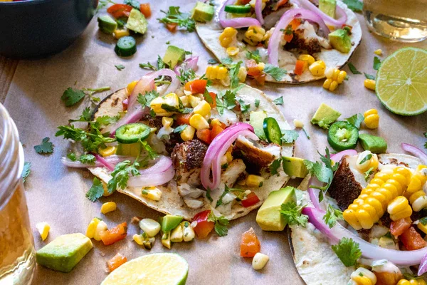 Image of To assemble the tacos, heat the taco shells according to...