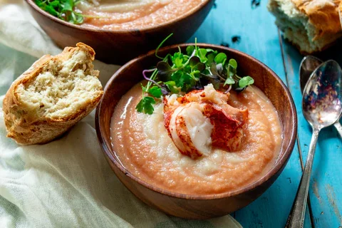 https://images.getrecipekit.com/20220428192648-lobster-bisque-recipe-shot_large.webp?width=700