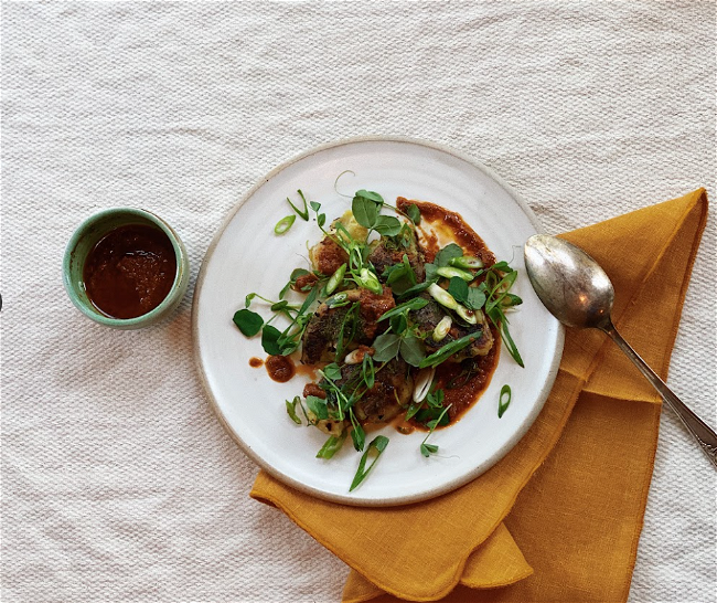 Image of Crispy Smashed Potatoes & Green Onions with Salsa Verde, Chermoula, or Harissa