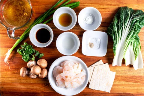 https://images.getrecipekit.com/20220429131335-shrimp-wanton-soup-ingredients_480x480.webp?width=700