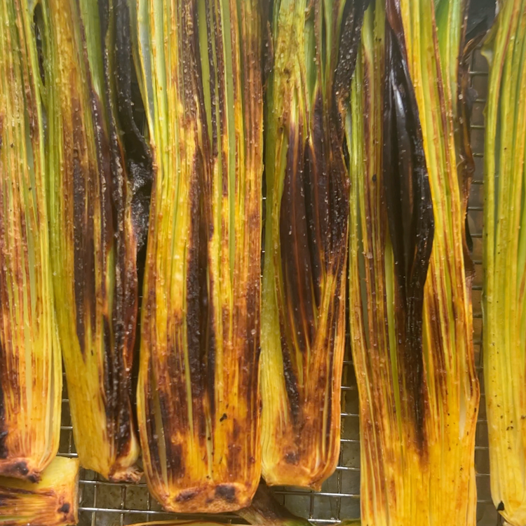 Image of Turn the leeks over and place the tray under the broiler again until the leeks are golden brown and tender.