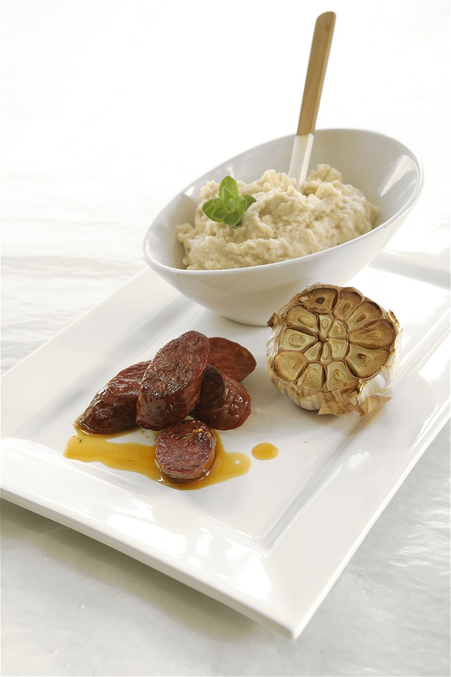 Image of Mastiha-Seared Sausages over Garlicky White Bean Purée