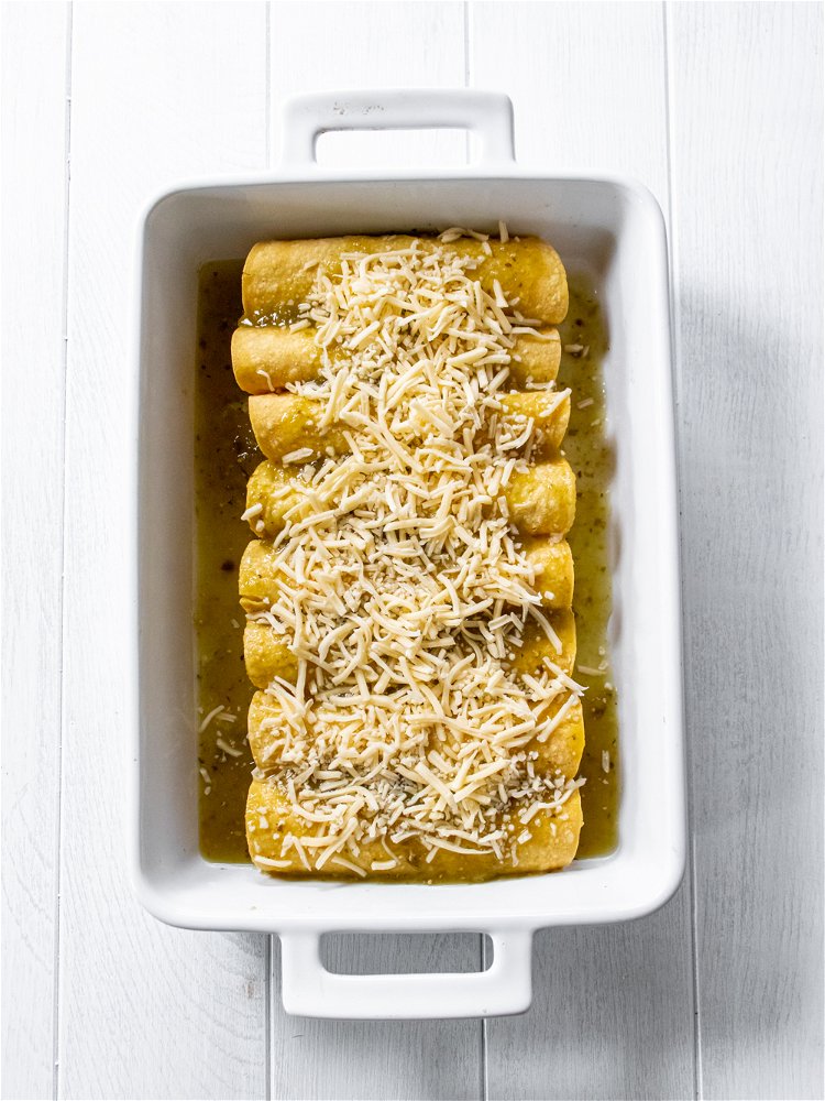Image of Place seam side down in casserole dish. Top enchiladas with...