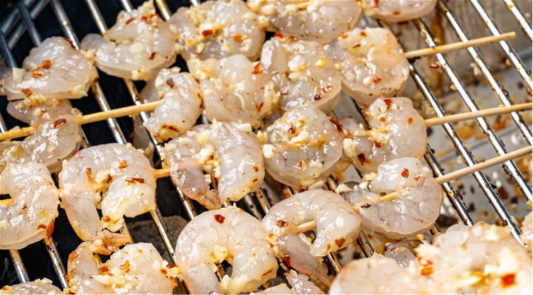 Image of Grill prawns over a gas or charcoal barbecue on high...