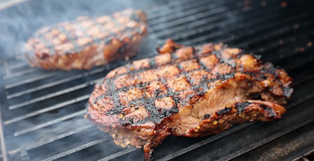 Image of Prepare grill for direct searing using Royal Oak Lump charcoal.