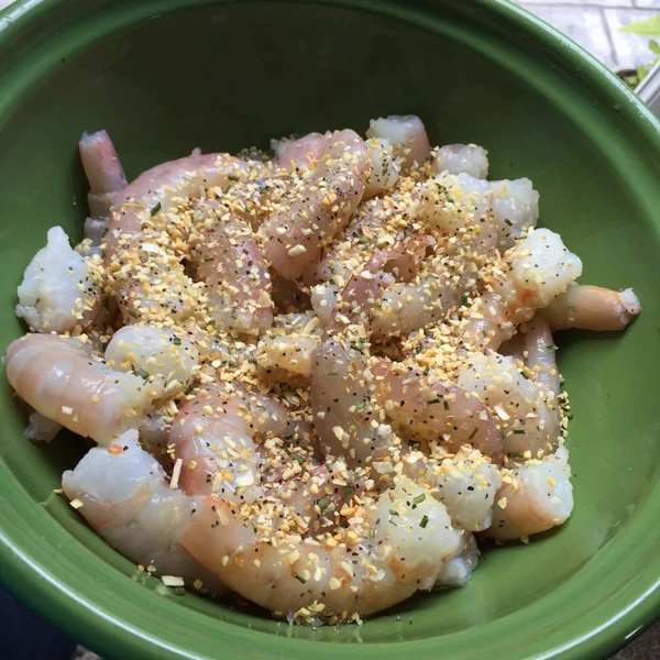 Image of Add all ingredients to a large bowl and toss to coat. Let sit while grill heats up.