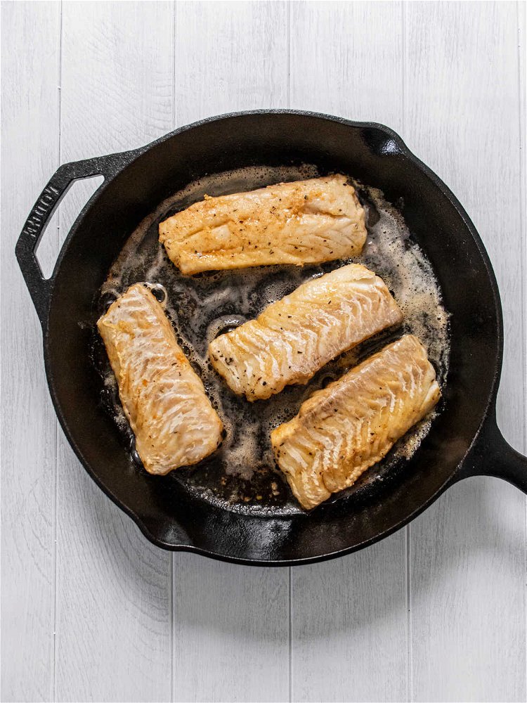 Image of When oil is shimmering, place cod in skillet and sear...
