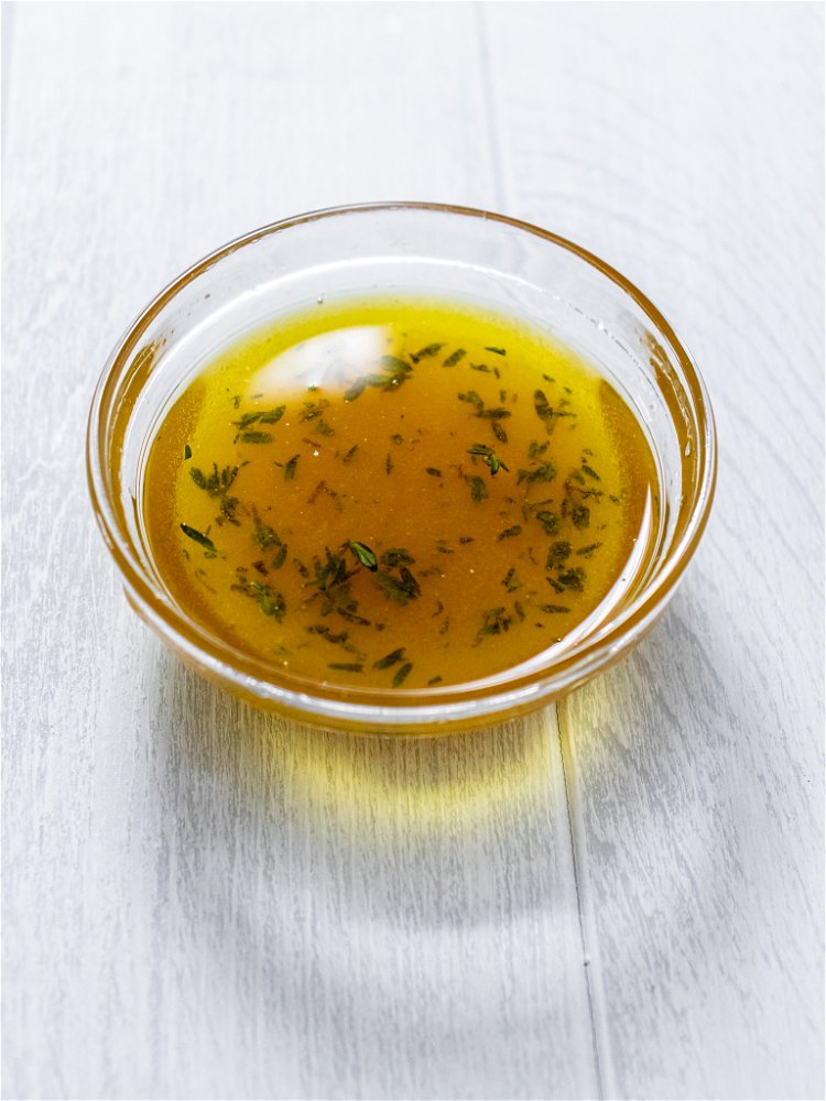 Image of Stir together olive oil, lemon juice, honey, half of thyme...