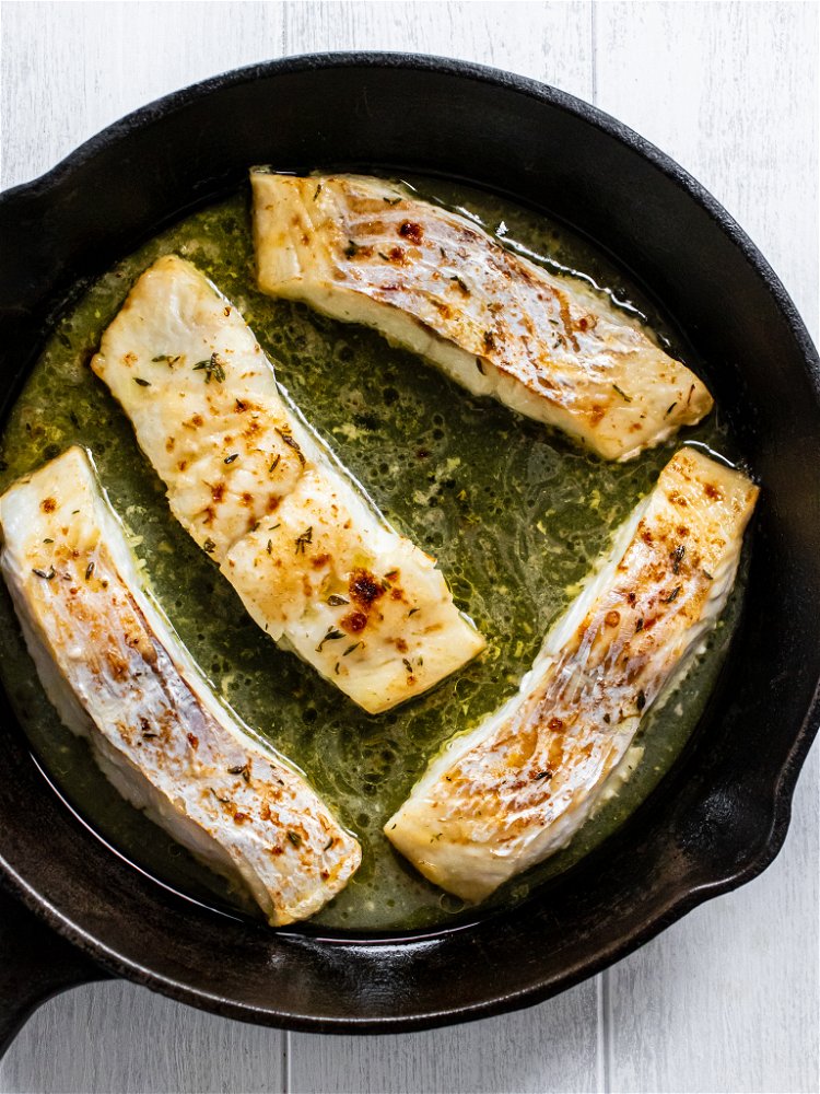 Image of Broil for 10-12 minutes, basting haddock with sauce from pan...
