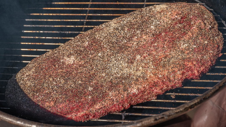 Image of Transfer brisket to the smoker and cook until your brisket reaches an internal temperature of 165º.