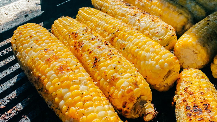 Image of Place ears over direct heat on a clean grill. Turn ears occasionally until corn is tender and browned in some spots (12-15 mins). 