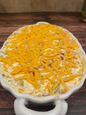 Image of Top off the dip with some thick cut shredded cheddar...