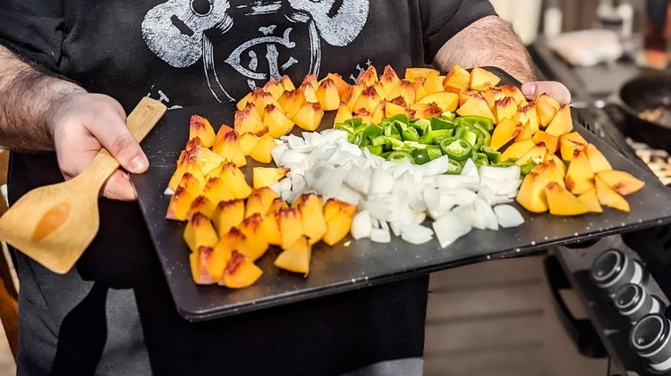 Image of Chop peaches, white onion, and green bell pepper into bite size pieces and mince garlic. Cook peaches, onion, pepper, and garlic over medium high heat in cast iron skillet for a couple of minutes using leftover bacon fat until onions...