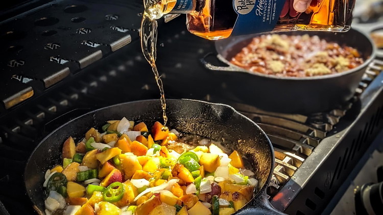 Image of Add bourbon to skillet and cook for another minute, stirring frequently.