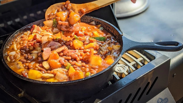 Image of Add cast iron pot to grill and cook at 300ºF for 1½ to 2 hours, stirring occasionally.