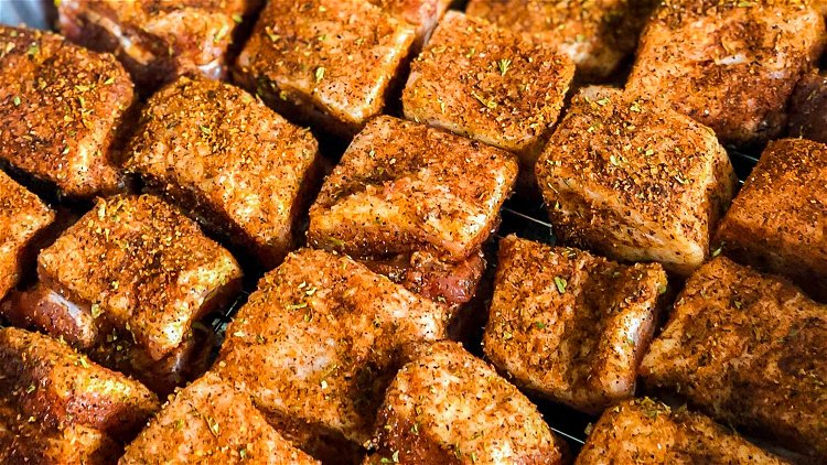 Image of Sprinkle sweet and savory seasoning on the pork belly, ensuring...