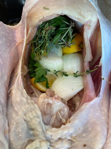 Image of Stuff the Turkey with a stick of unsalted butter, lemon...
