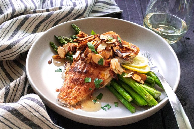 Image of Serve the trout fillets on a platter, pour the almond...