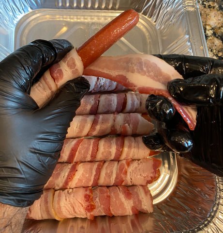 Image of Start wrapping the hot dogs in bacon 