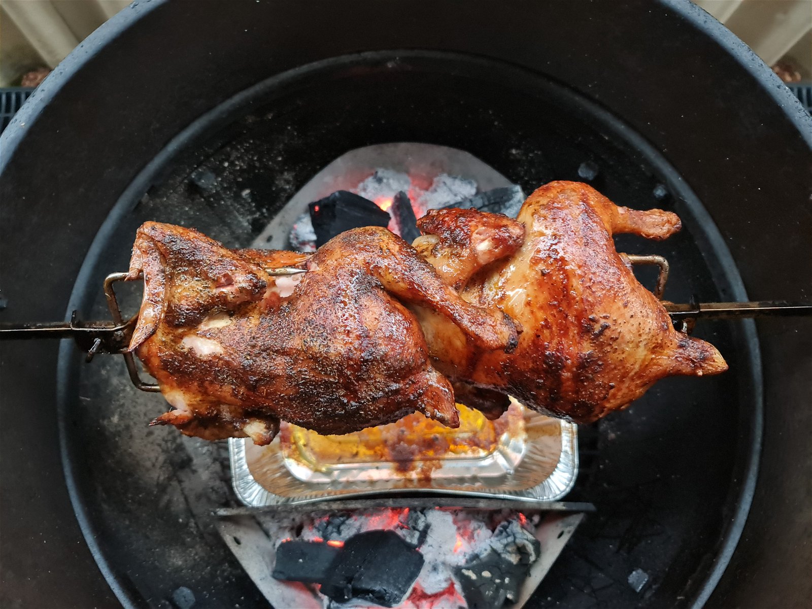 Rotisserie chicken on outlet grill