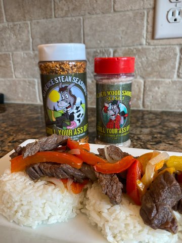 Image of Add Steak, peppers and onions on top of the rice...