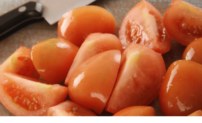Image of Take about 6 of your peeled tomatoes and cut them...